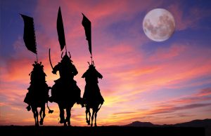 warriors on horseback with flags and moon above